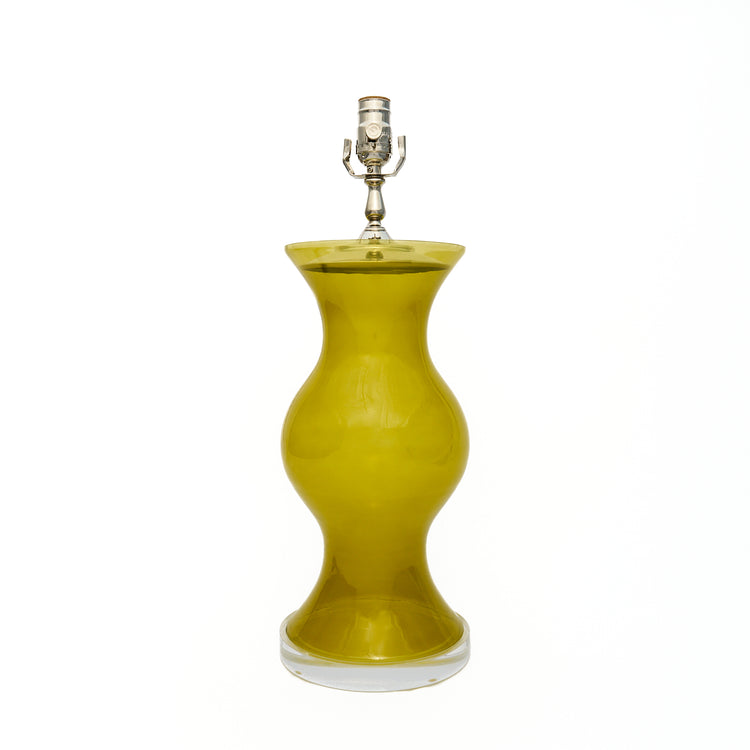 Citron green lamp with a lucite base on a white background