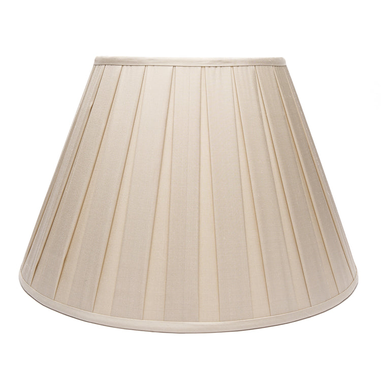 A box-pleated fabric lampshade in ecru silk