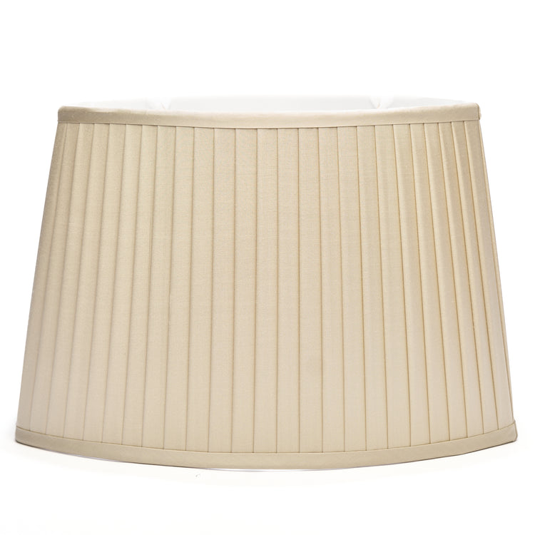 A knife pleated flat sided oval silk lampshade in ecru