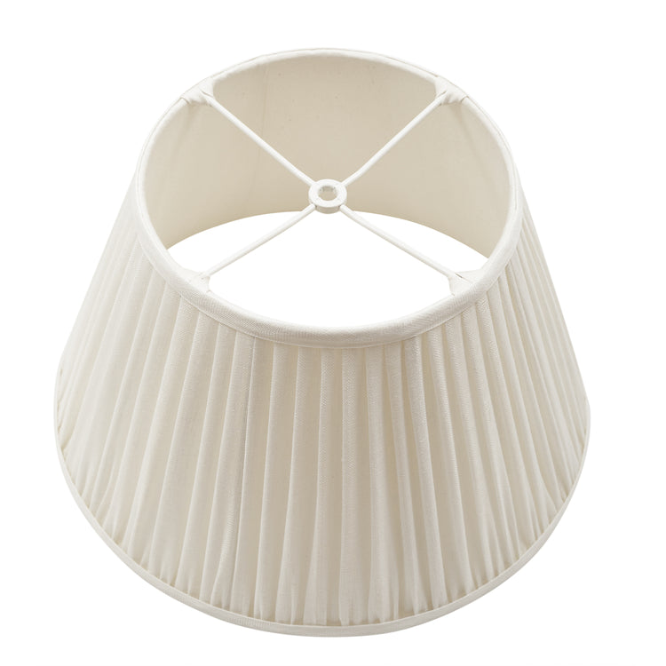 The US fitter of a beige pleated lampshade on a white background