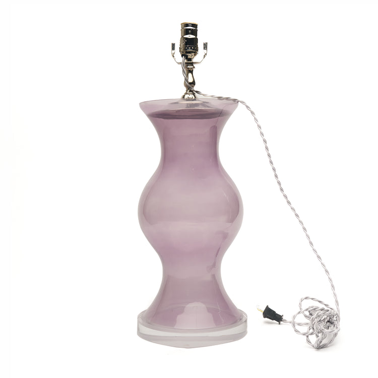 A table lamp with purple glass, a silver metal socket, and a coiled silver wire cord on a plain white background.