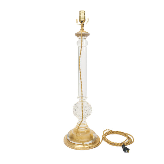 Single table lamp with gold and clear design on a white background
