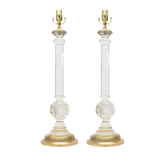 Pair of table lamps with gold and clear design on a white background