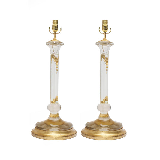 Pair of table lamps with gold and clear design on a white background