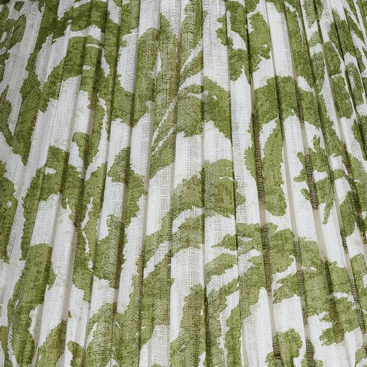 Close-up of a shade with a green and white patterned fabric
