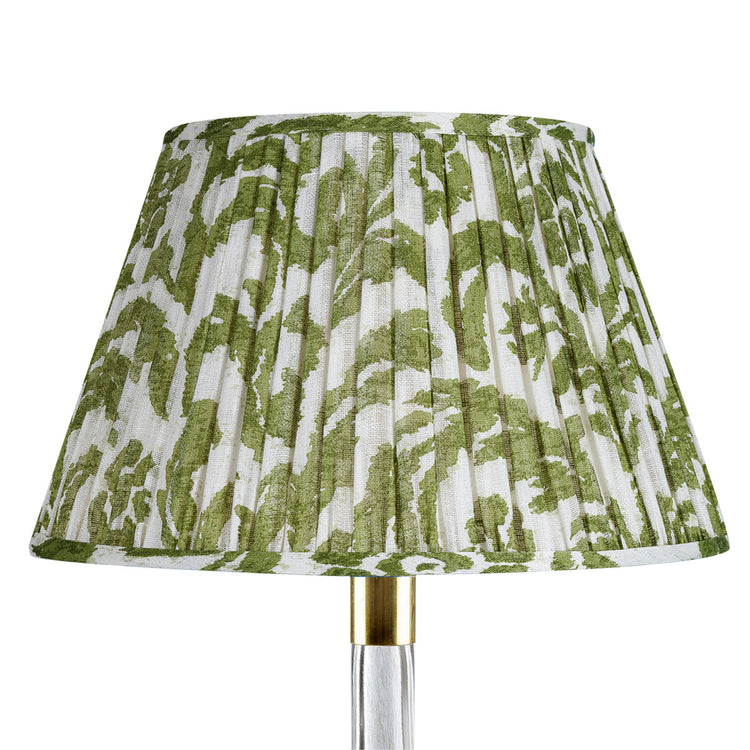 Green and white patterned lampshade on a white background