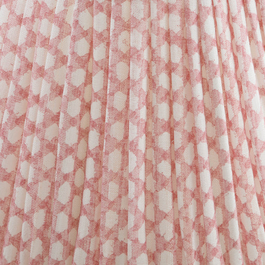 Close-up of a shade with a pink and white checkered fabric