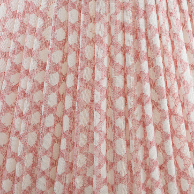 Close-up of a shade with a pink and white checkered fabric