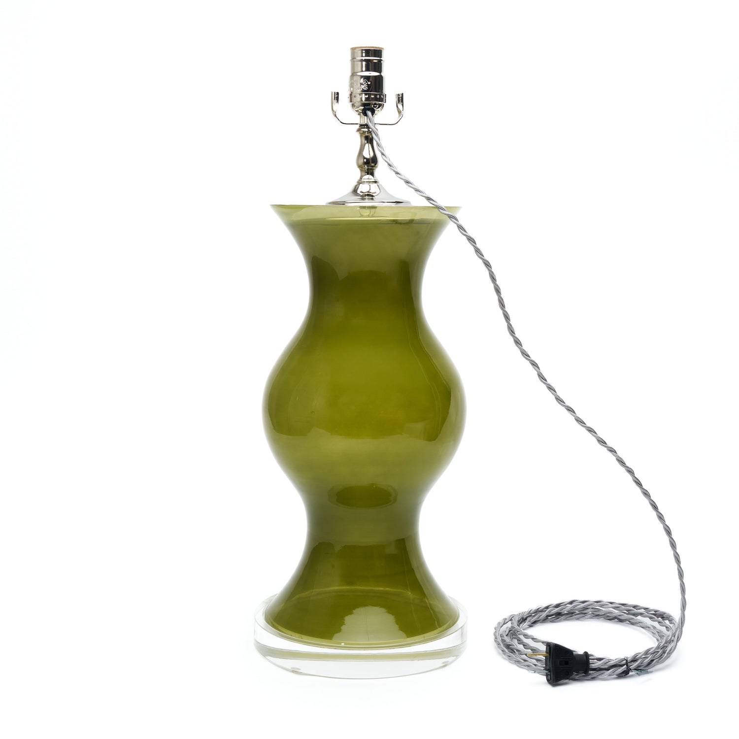A table lamp with green glass, a silver metal socket, and a coiled silver wire cord on a plain white background.