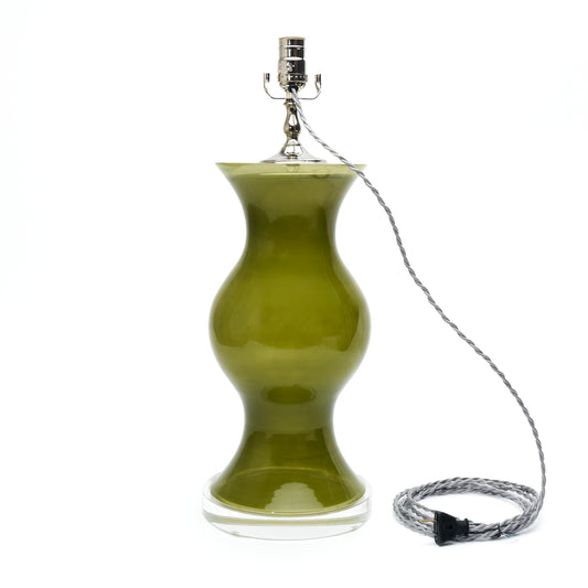 A table lamp with green glass, a silver metal socket, and a coiled silver wire cord on a plain white background.