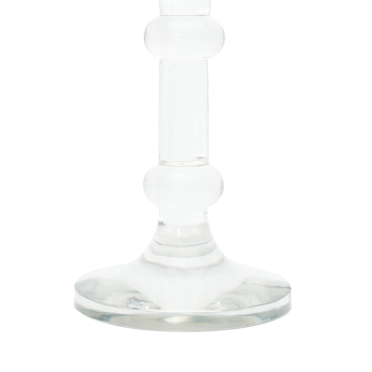 A close-up of a table lamp base, featuring a clear glass base and a clear glass stem, shown against a plain white background.