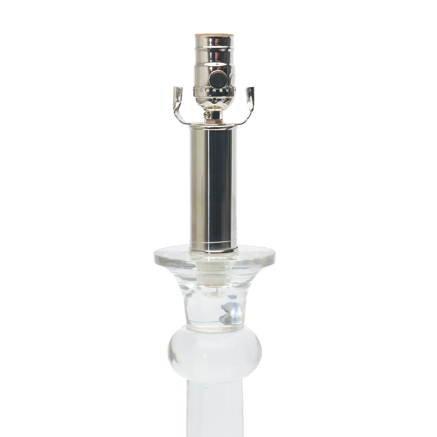 Clear glass table lamp with a nickel top on a white background